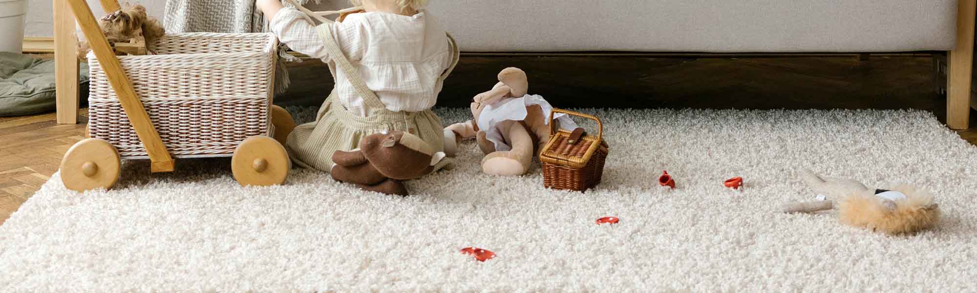 Kids rugs of beige colour on which toys are scattered