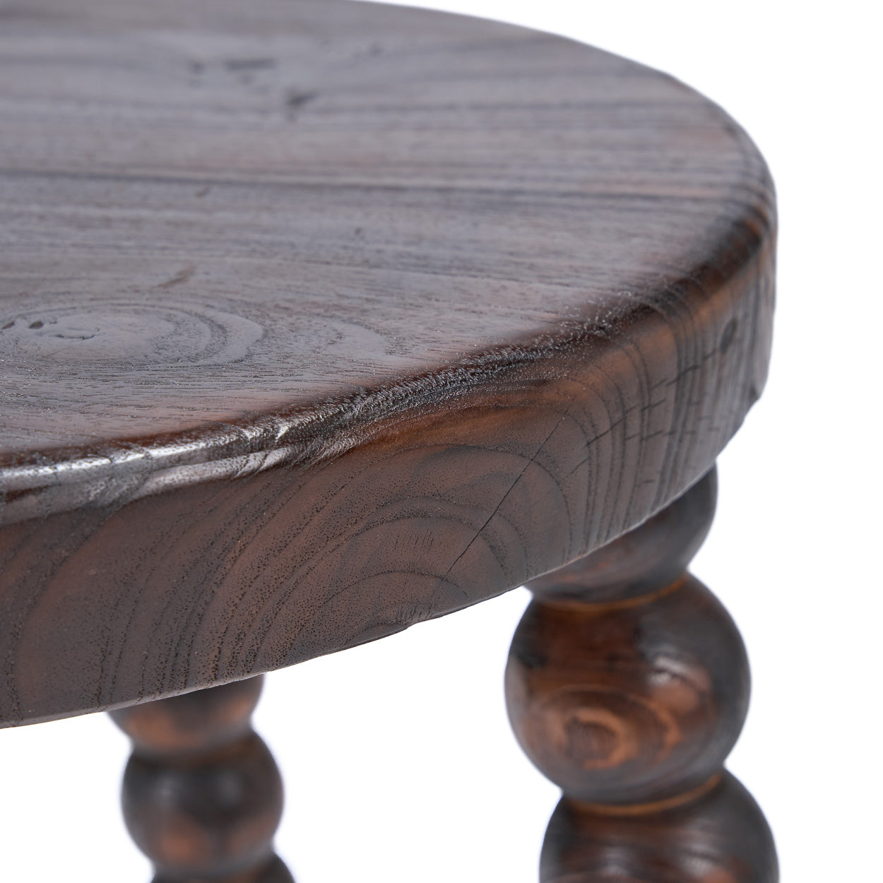 Wooden stool with a round top on a white background