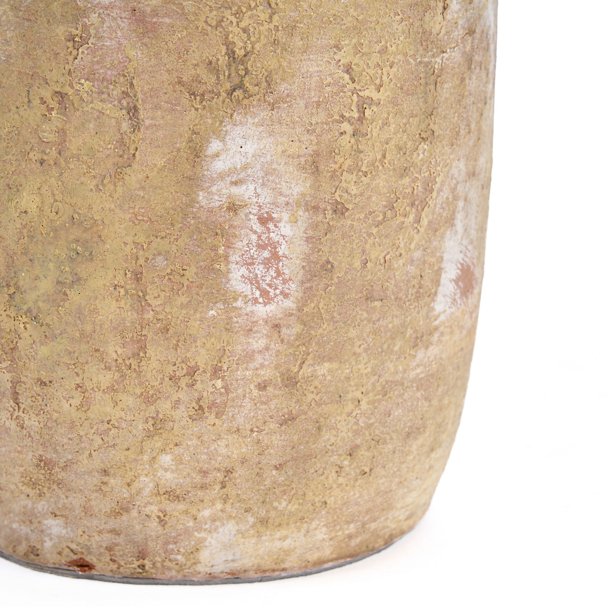 Close-up of a textured vase on a white background