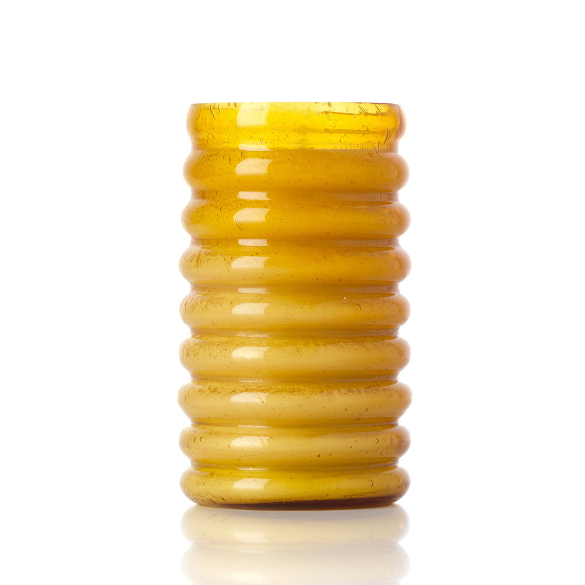 Tall yellow glass candle holder on a white background