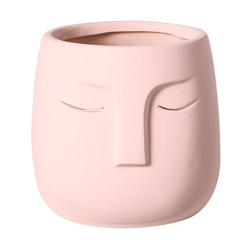 Vaso da fiori con testa di faccia in ceramica