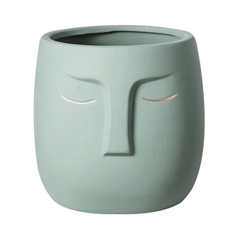 Vaso da fiori con testa di faccia in ceramica