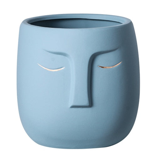Vaso da fiori con testa di faccia in ceramica