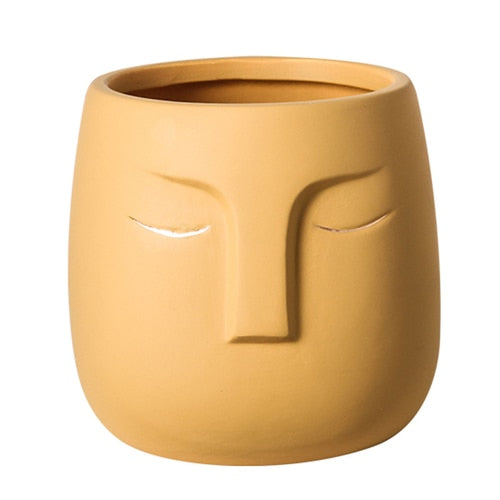 Vaso da fiori con testa di faccia in ceramica