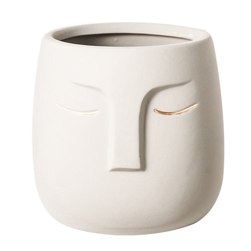 Vaso da fiori con testa di faccia in ceramica
