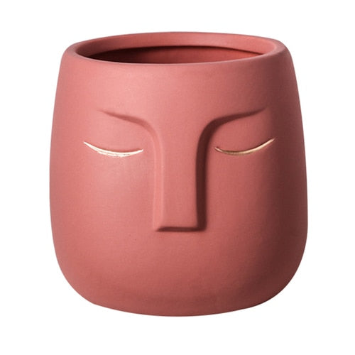 Vaso da fiori con testa di faccia in ceramica
