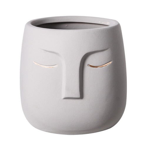 Vaso da fiori con testa di faccia in ceramica