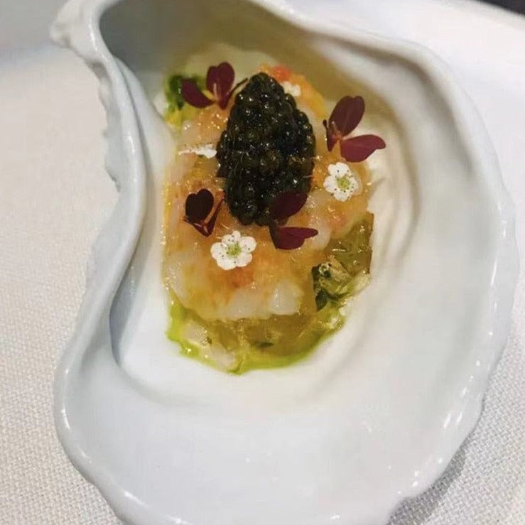 Piatto in ceramica irregolare a forma di ostrica