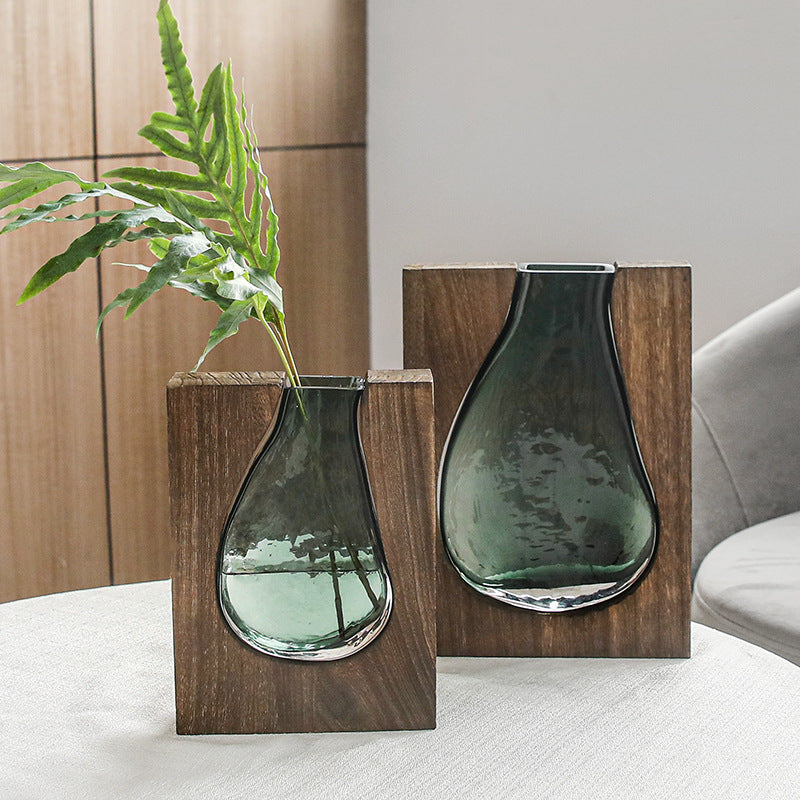 Vaso di vetro trasparente in legno massiccio con tronco