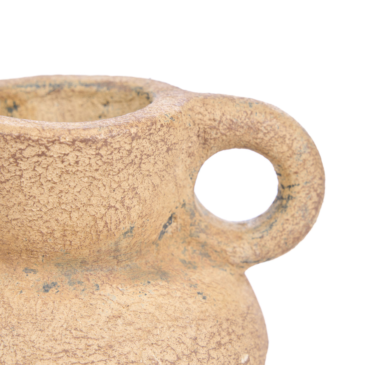 Close-up of a beige pot with a handle on a white background