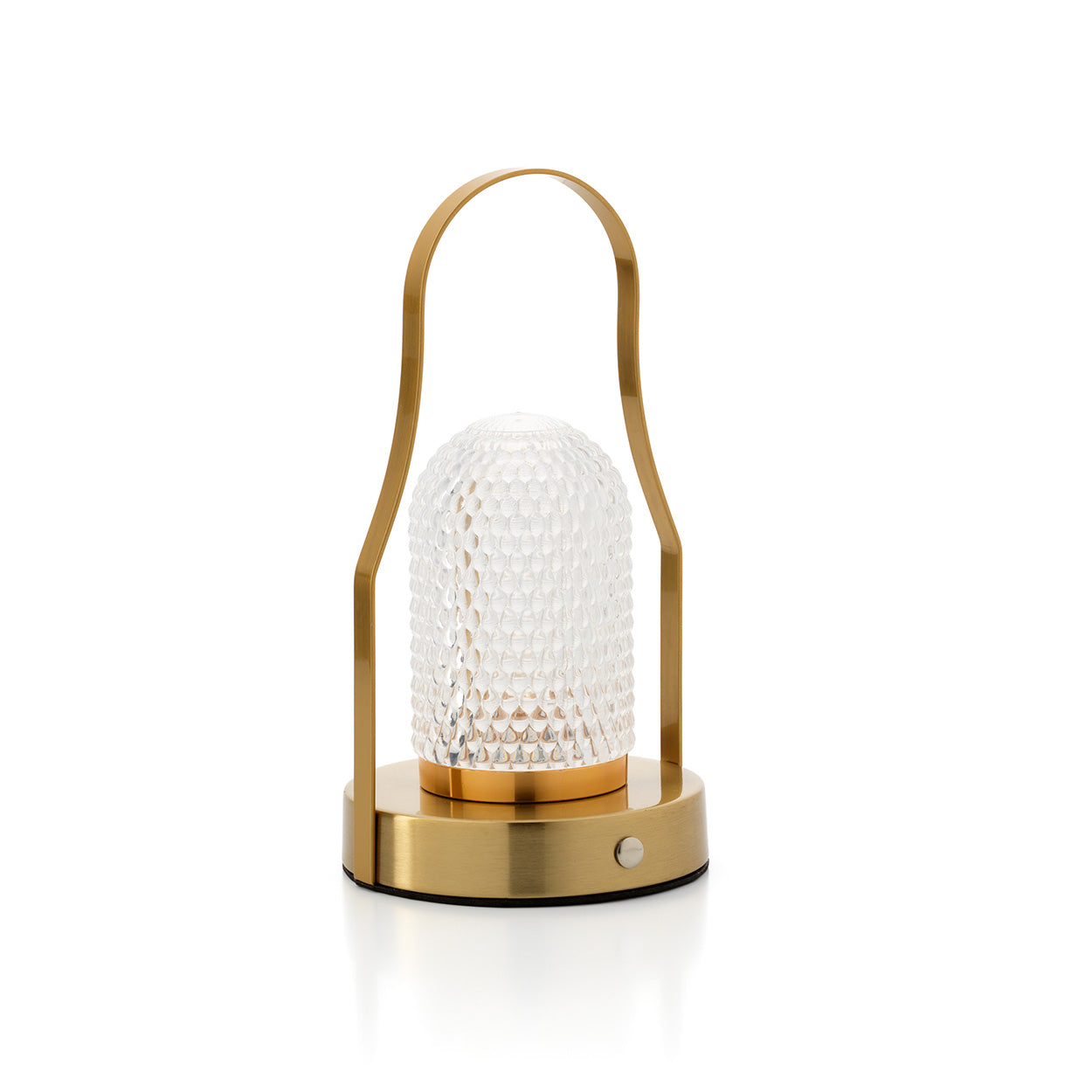 Gold table lamp with textured glass shade on a white background