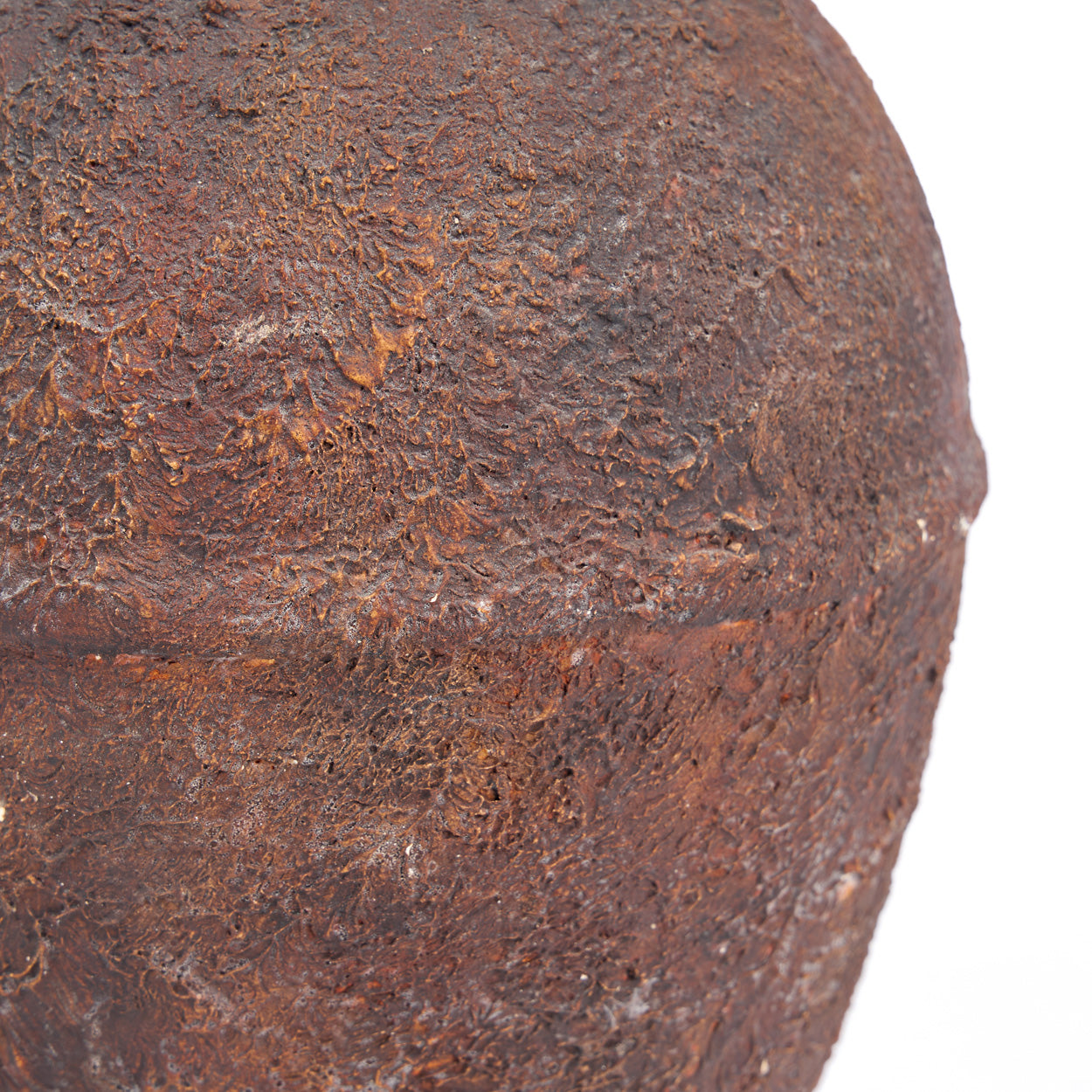 Close-up of a rusted vase on a white background