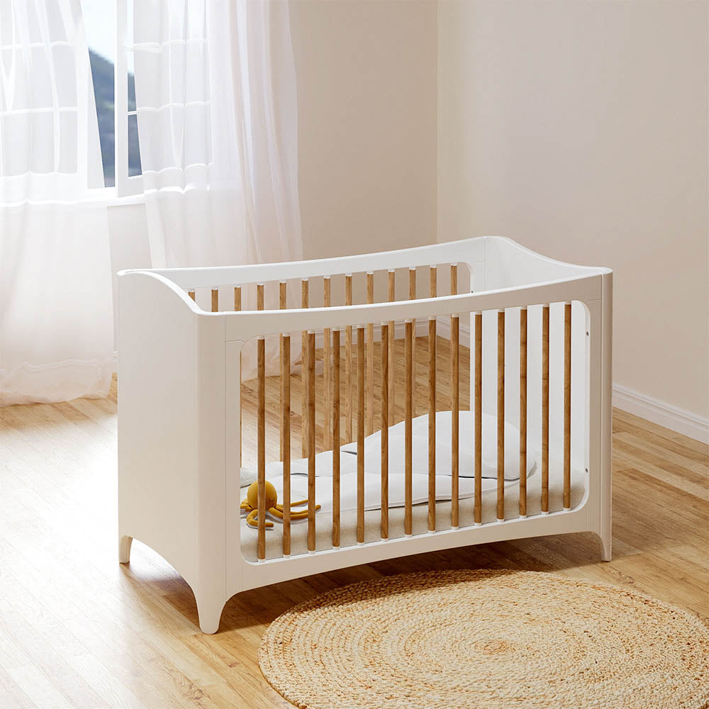 NEREE LIT Bed 60X120 - Neige with wooden slats on a wooden floor in a bright room.