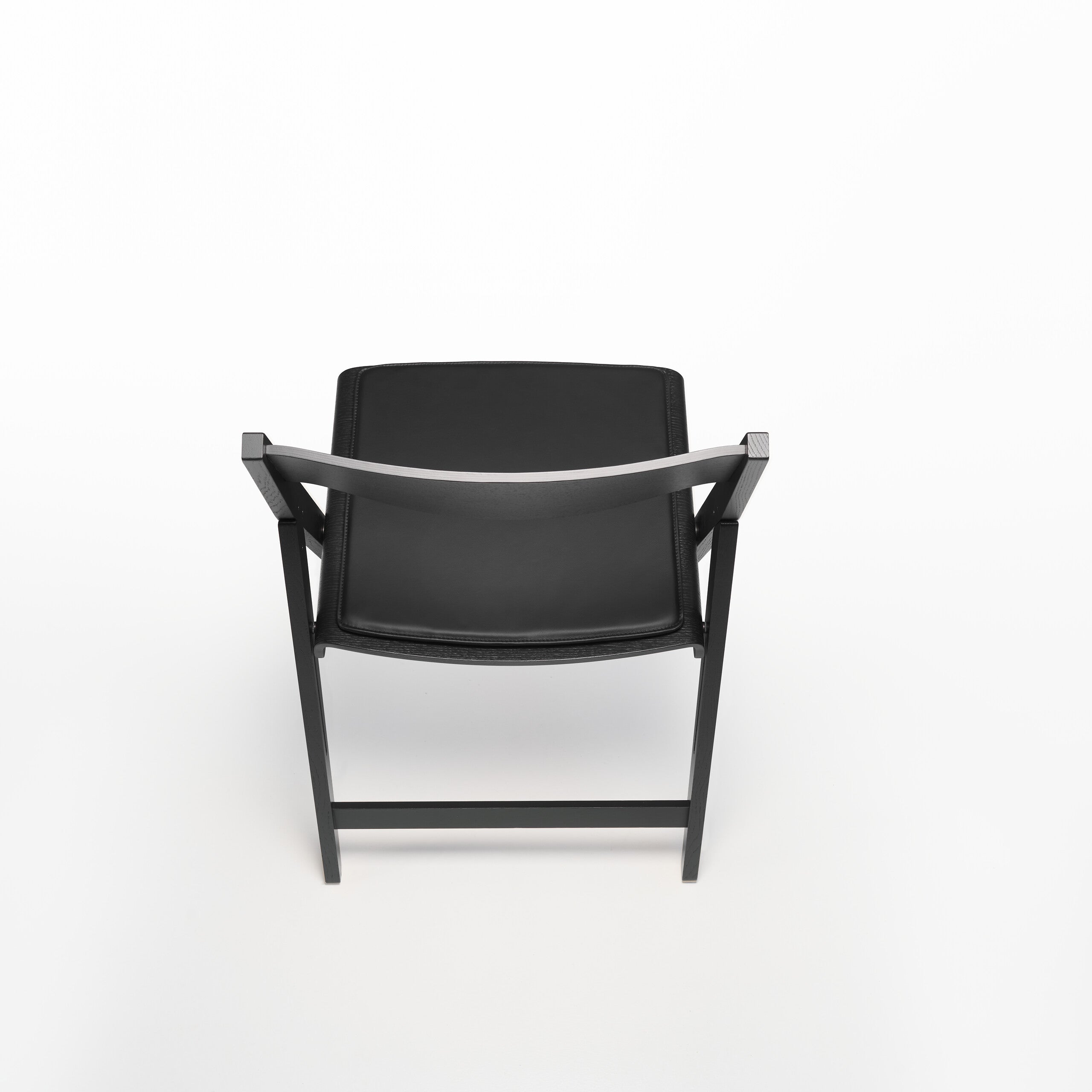 Black THEO chair with soft part a white background