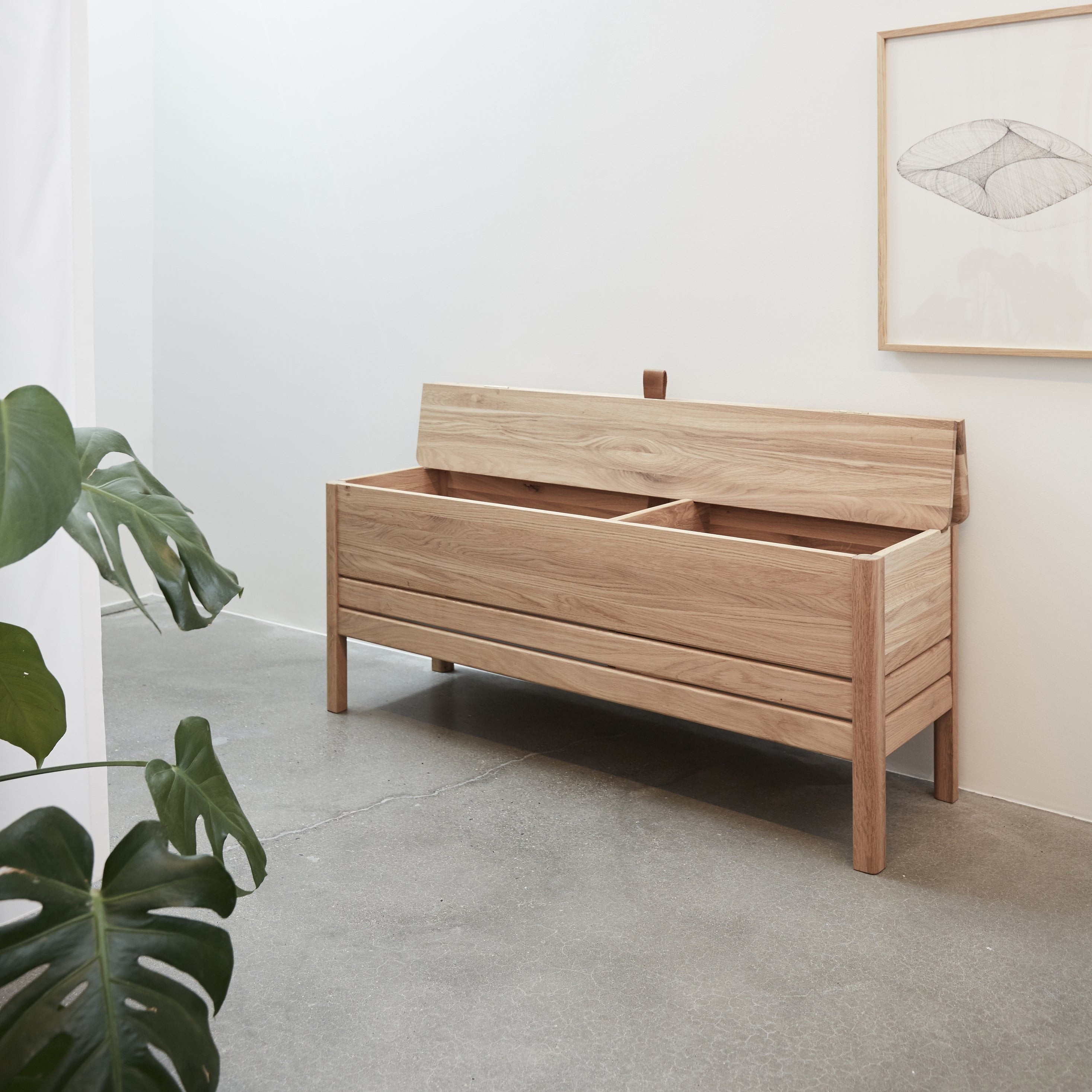A LINE Storage Bench front interior view of natural finish