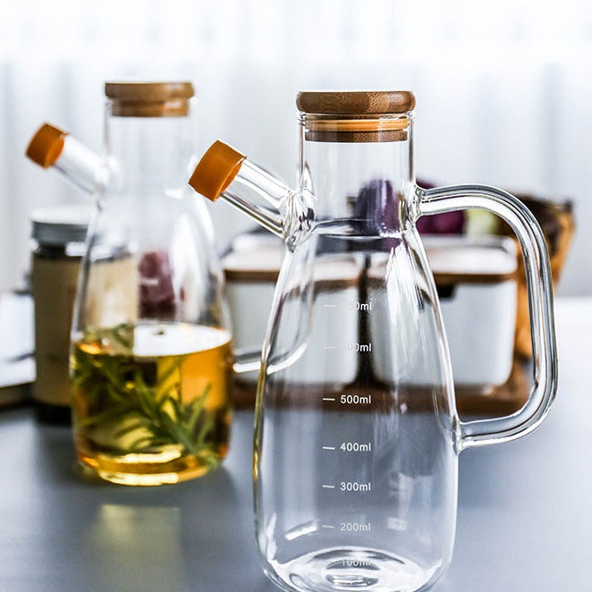 Bottiglia per olio in vetro trasparente con manico